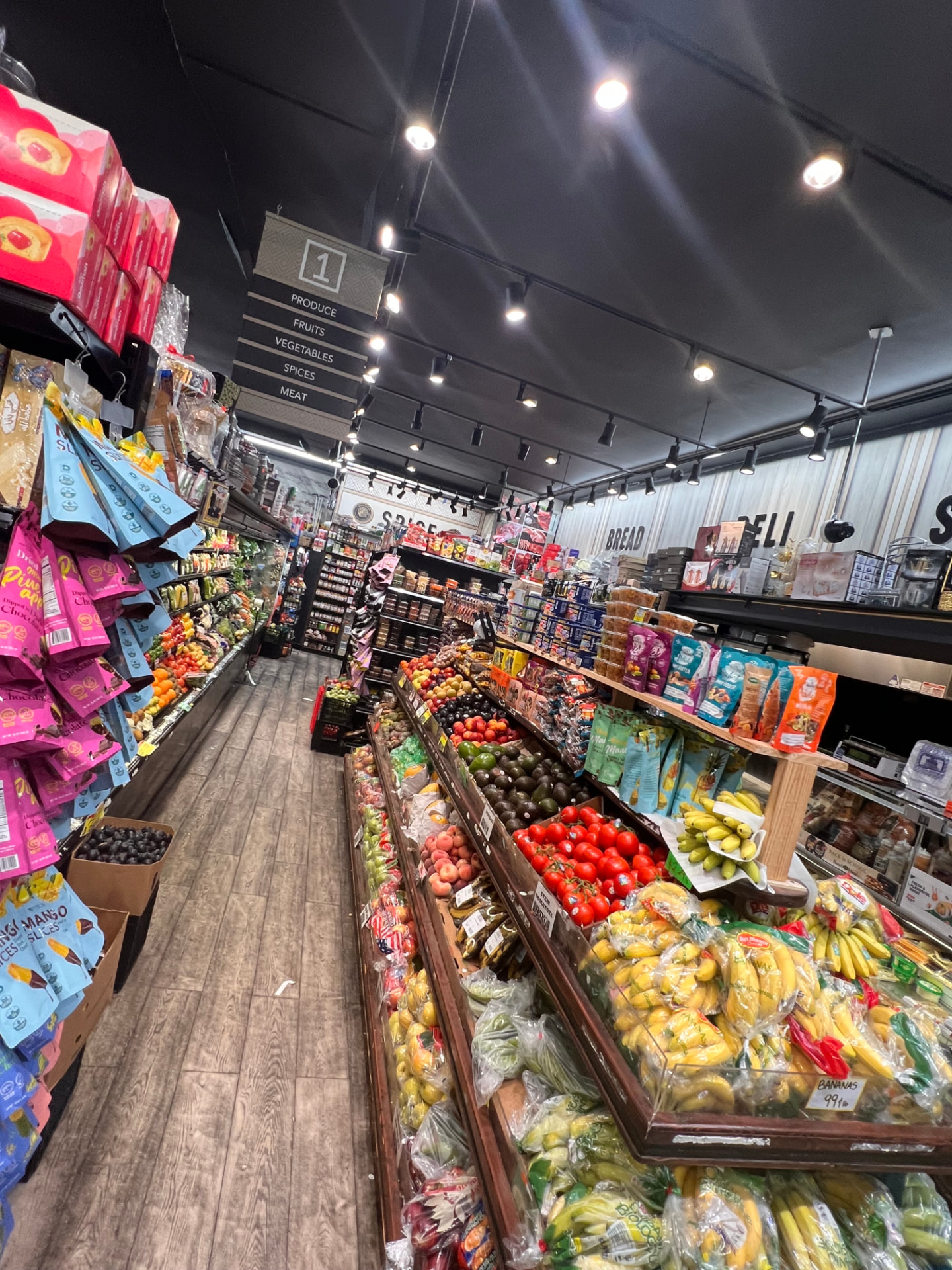 Produce, fruits and vegetables aisle inside Hana Market